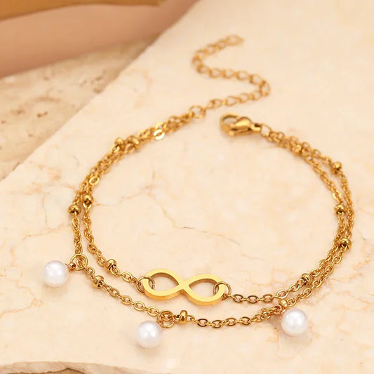 Dahlia - Aranyszínű dupla soros karkötő gyöngyökkel